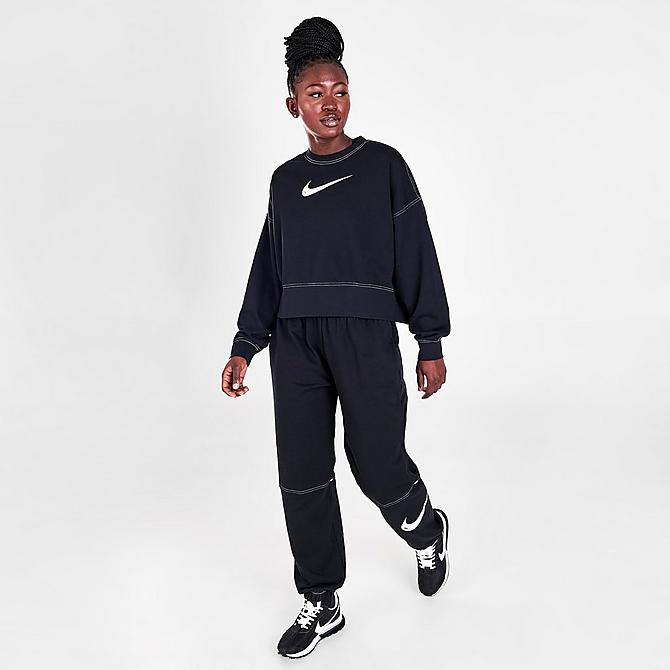 Front Three Quarter view of Woman's Nike Sportswear Swoosh High-Rise Jogger Pants in Black/Black/Black/White Click to zoom