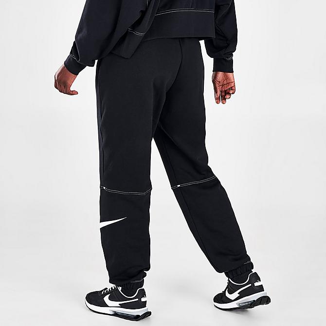 Back Right view of Woman's Nike Sportswear Swoosh High-Rise Jogger Pants in Black/Black/Black/White Click to zoom