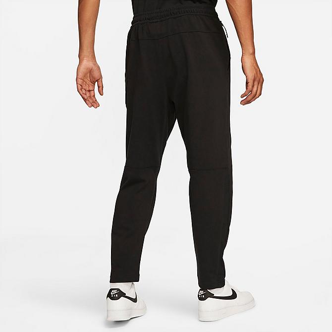 Front Three Quarter view of Men's Nike Sportswear Lightweight Open Hem Knit Pants in Black/Black/Black Click to zoom