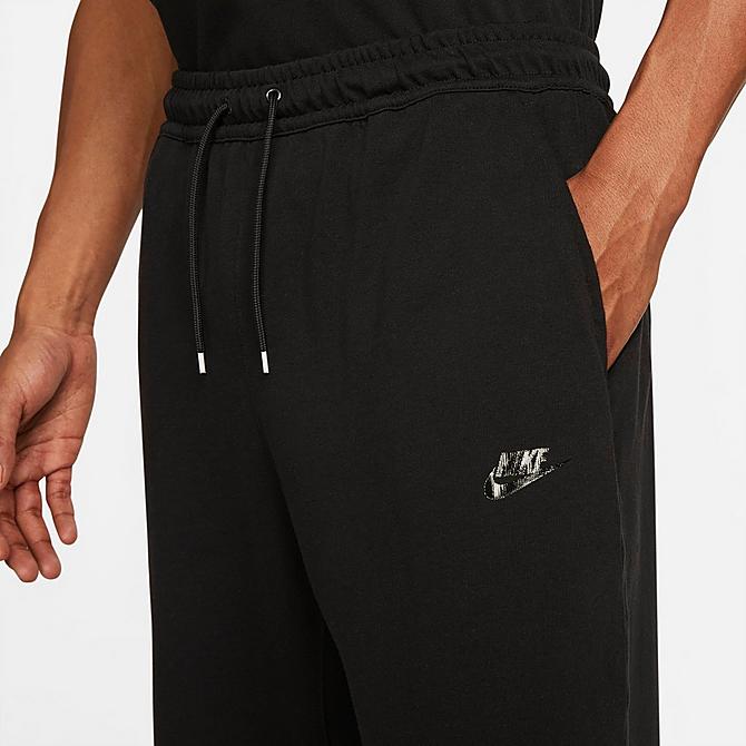 Back Right view of Men's Nike Sportswear Lightweight Open Hem Knit Pants in Black/Black/Black Click to zoom