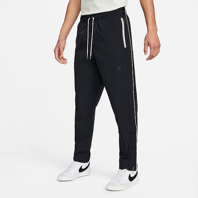 Front view of Men's Nike Sportswear Style Essentials Tearaway Pants in Black/Sail/Ice Silver/Black Click to zoom