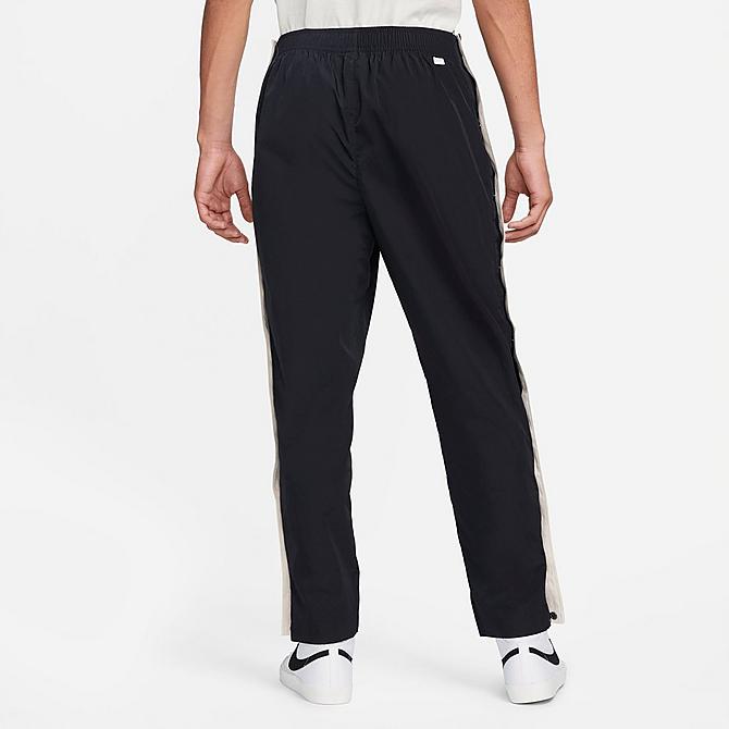 Front Three Quarter view of Men's Nike Sportswear Style Essentials Tearaway Pants in Black/Sail/Ice Silver/Black Click to zoom