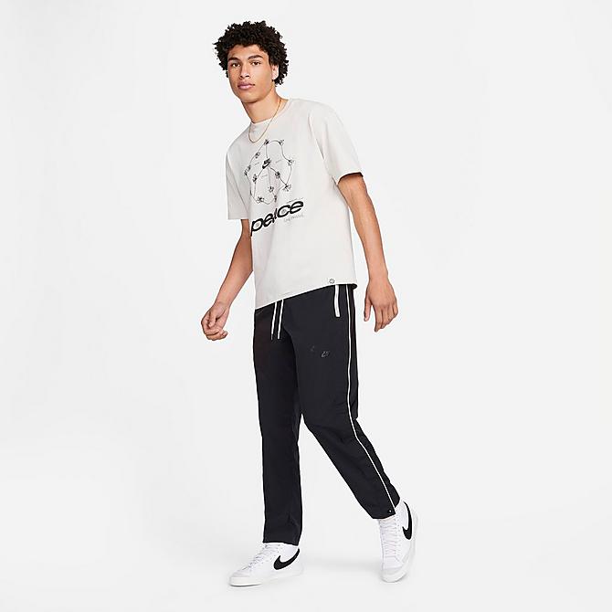 Back Left view of Men's Nike Sportswear Style Essentials Tearaway Pants in Black/Sail/Ice Silver/Black Click to zoom