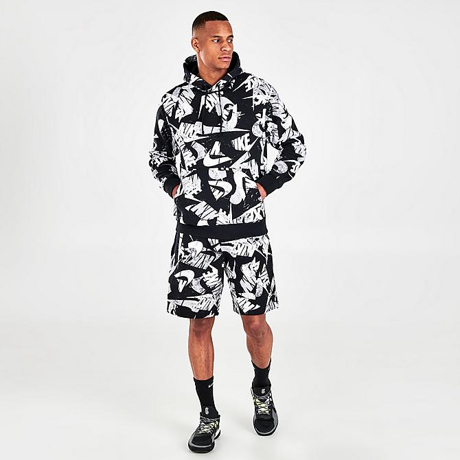 Front Three Quarter view of Men's Nike Sportswear Sport Essentials+ All-Over Print Pullover Hoodie in Black/White Click to zoom