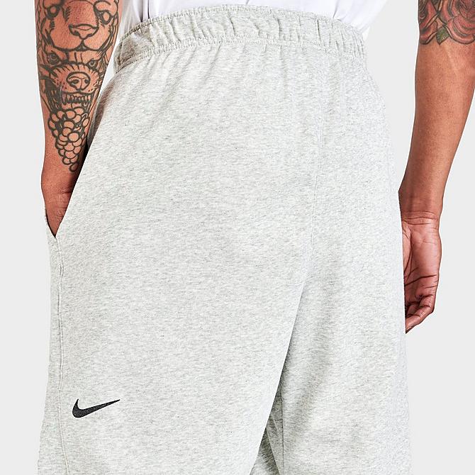 On Model 5 view of Men's Nike Yoga Therma-FIT Pants in Grey Heather/Iron Grey Click to zoom