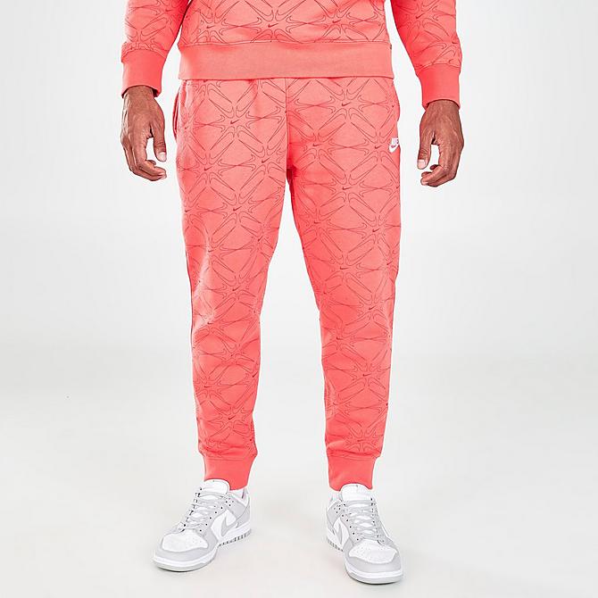 Front Three Quarter view of Men's Nike Sportswear Club Allover Print Jogger Pants in Magic Ember Click to zoom