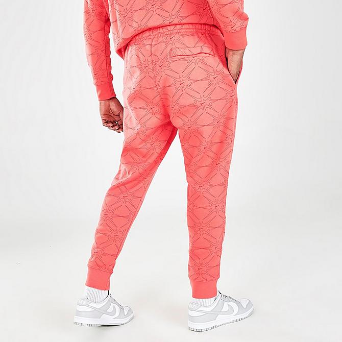 Back Right view of Men's Nike Sportswear Club Allover Print Jogger Pants in Magic Ember Click to zoom