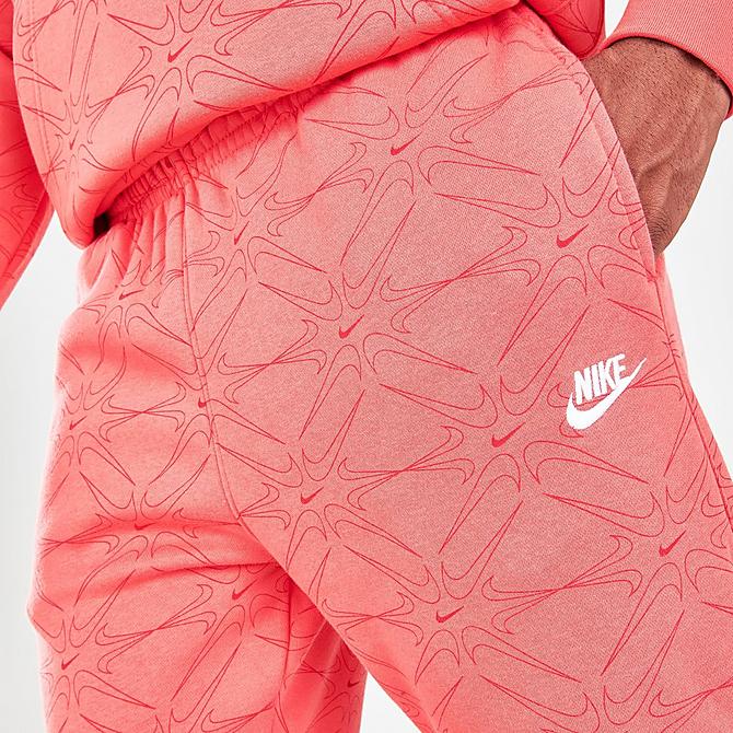 On Model 5 view of Men's Nike Sportswear Club Allover Print Jogger Pants in Magic Ember Click to zoom