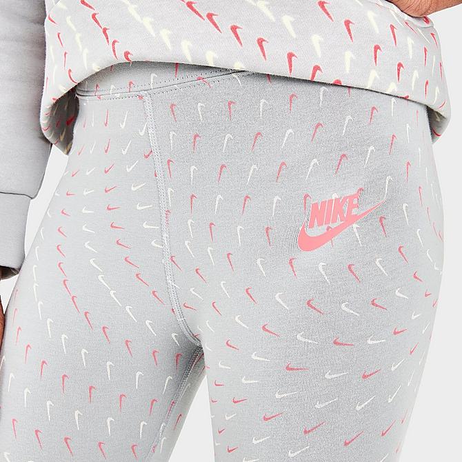 On Model 5 view of Girls' Nike Sportswear Essential Swooshfetti Printed Leggings in Light Smoke Grey/Pink Salt Click to zoom