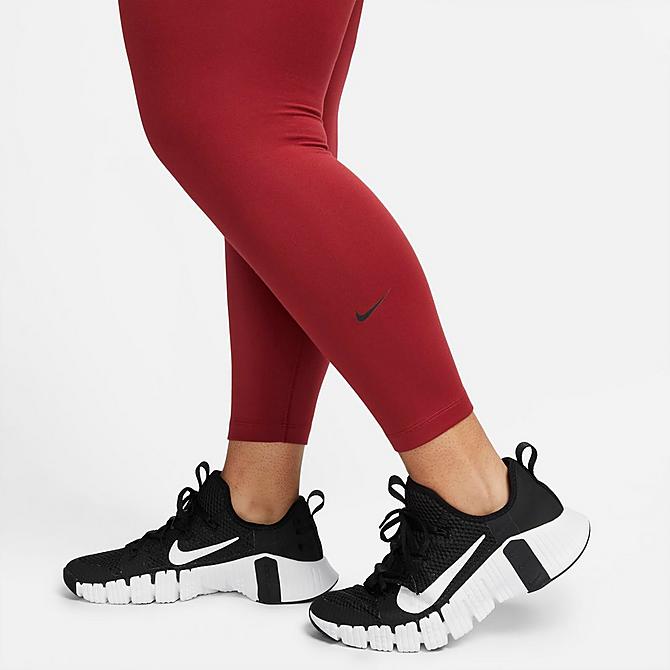 On Model 6 view of Women's Nike Therma-FIT One Mid-Rise Leggings (Plus Size) in Pomegranate/Black Click to zoom