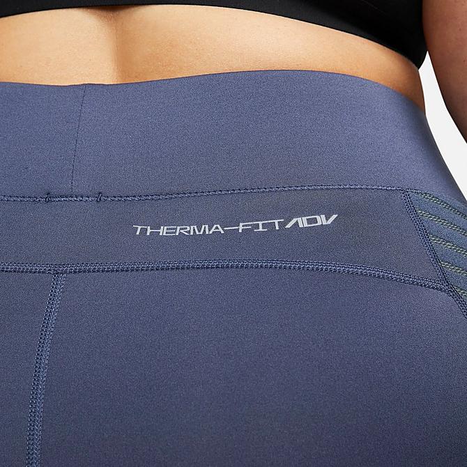 On Model 5 view of Women's Nike Pro Therma-FIT ADV High-Waisted Training Tights (Plus Size) in Thunder Blue/Metallic Silver Click to zoom