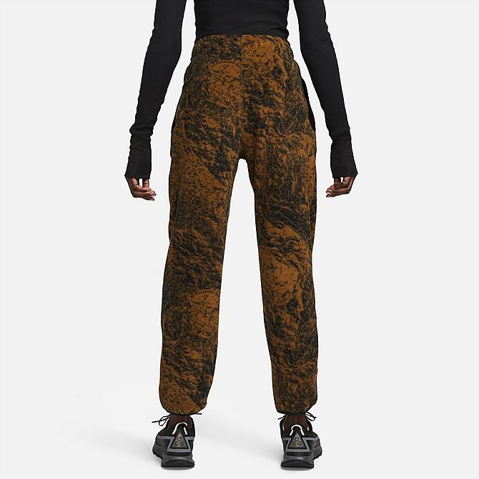 Front Three Quarter view of Women's Nike ACG Therma-FIT Wolf Tree Allover Print Pants in Hazel Rush/Black/Summit White Click to zoom