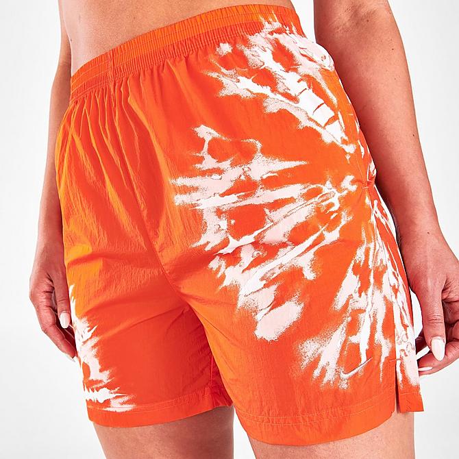 On Model 5 view of Women's Nike Sportswear Woven Resort Shorts in Orange Click to zoom