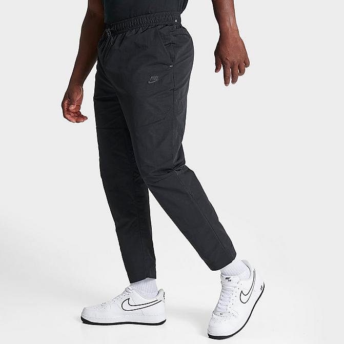 Front view of Men's Nike Sportswear Tech Essentials Lined Commuter Pants in Black/Black Click to zoom
