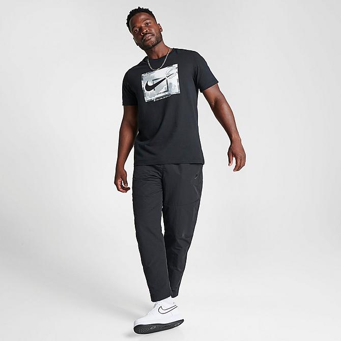 Front Three Quarter view of Men's Nike Sportswear Tech Essentials Lined Commuter Pants in Black/Black Click to zoom