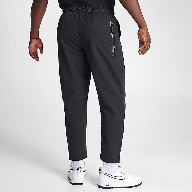 Back Right view of Men's Nike Sportswear Tech Essentials Lined Commuter Pants in Black/Black Click to zoom