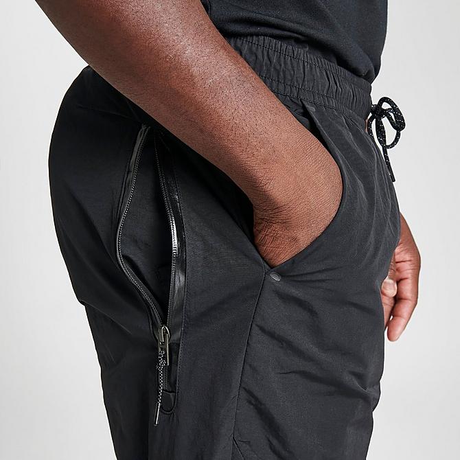 On Model 6 view of Men's Nike Sportswear Tech Essentials Lined Commuter Pants in Black/Black Click to zoom