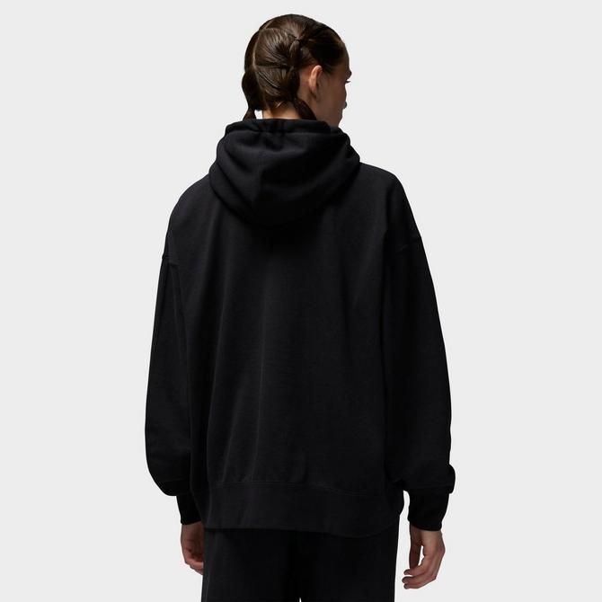 Front Three Quarter view of Women's Jordan Flight Label Fleece Hoodie in Black Click to zoom