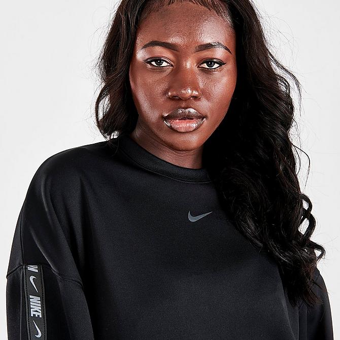On Model 5 view of Women's Nike Sportswear Tape Logo Oversized Sweatshirt in Black Click to zoom