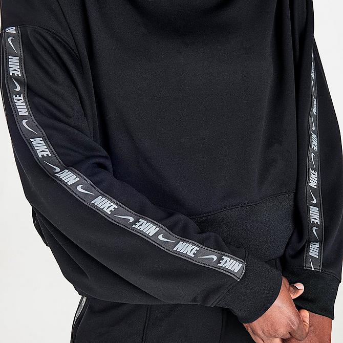 On Model 6 view of Women's Nike Sportswear Tape Logo Oversized Sweatshirt in Black Click to zoom