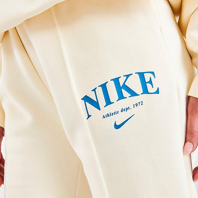 On Model 5 view of Women's Nike Sportswear Collection Essentials Collegiate Fleece Jogger Pants in Coconut Milk/Dutch Blue Click to zoom