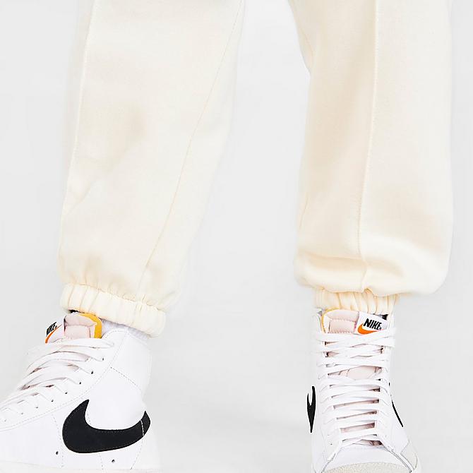 On Model 6 view of Women's Nike Sportswear Collection Essentials Collegiate Fleece Jogger Pants in Coconut Milk/Dutch Blue Click to zoom