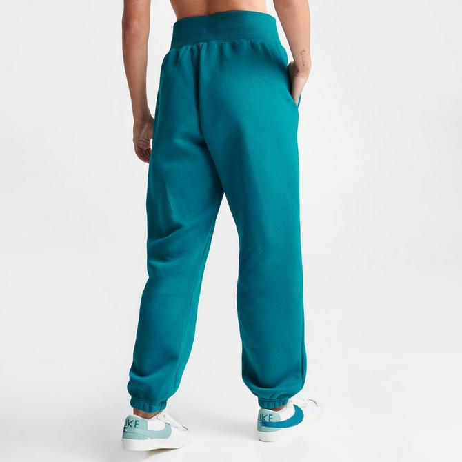 Nike Sweatpants PHOENIX FLEECE in light green