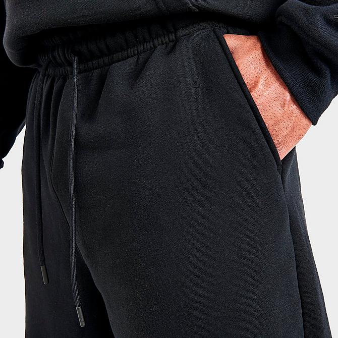 On Model 6 view of Men's Jordan Essential Jumpman Fleece Shorts in Black/White Click to zoom