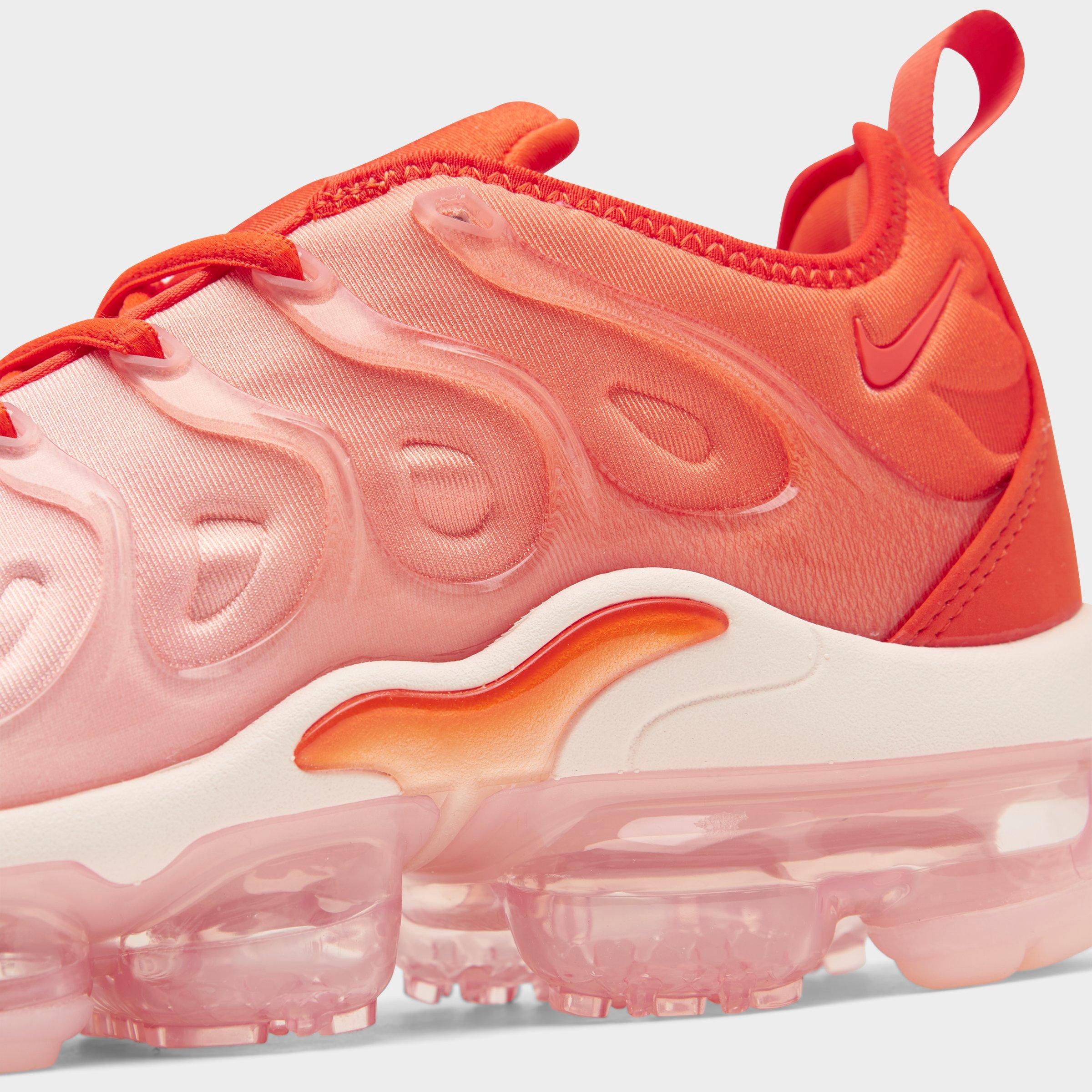 women's white and orange vapormax