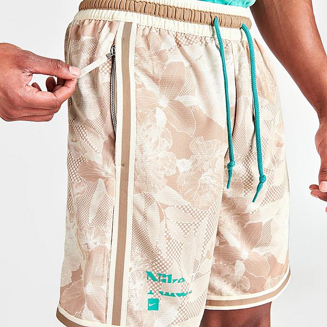 On Model 6 view of Men's Nike Dri-FIT DNA+ Printed Basketball Shorts in Hemp Click to zoom