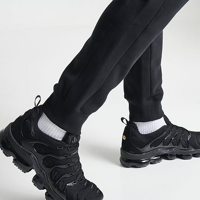 On Model 6 view of Men's Nike Sportswear Hybrid Fleece Jogger Pants in Black/Dark Smoke Grey/Black Click to zoom