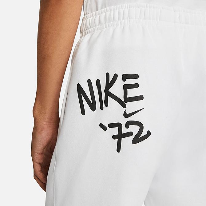 On Model 5 view of Men's Nike Sportswear Club Fleece Doodleglyph Graphic Print Sweatpants in White Click to zoom