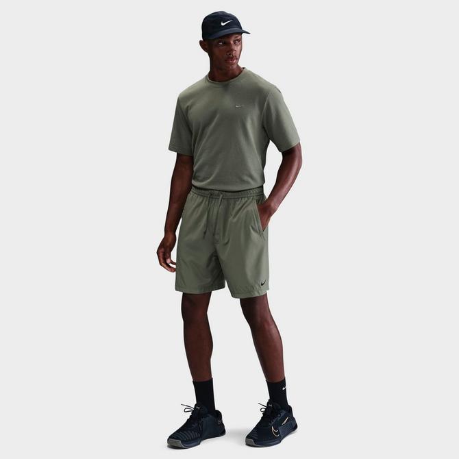 [angle] view of Men's Nike Form Dri-FIT Unlined 7" Versatile Shorts in Light Army/Black Click to zoom