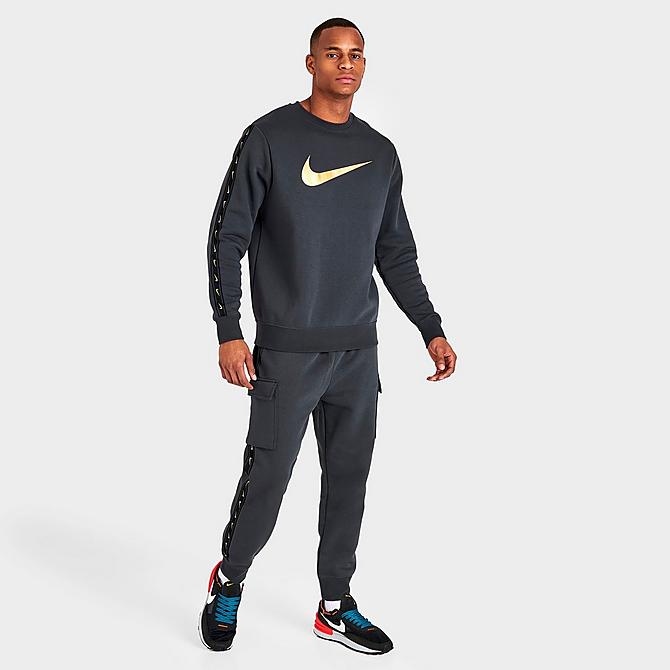 Front Three Quarter view of Men's Nike Sportswear Repeat Tape Fleece Crewneck Sweatshirt in Dark Smoke Grey/Metallic Gold Click to zoom