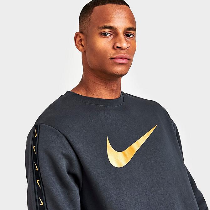 On Model 5 view of Men's Nike Sportswear Repeat Tape Fleece Crewneck Sweatshirt in Dark Smoke Grey/Metallic Gold Click to zoom
