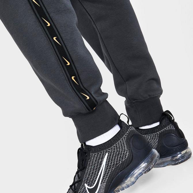 nike repeat logo taping cargo joggers in black