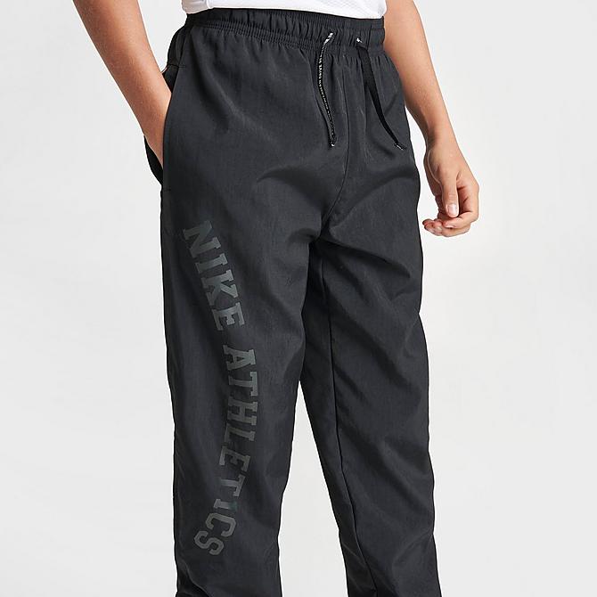 On Model 5 view of Kids' Nike Repel Athletics Training Jogger Pants in Black/Black/White/White Click to zoom