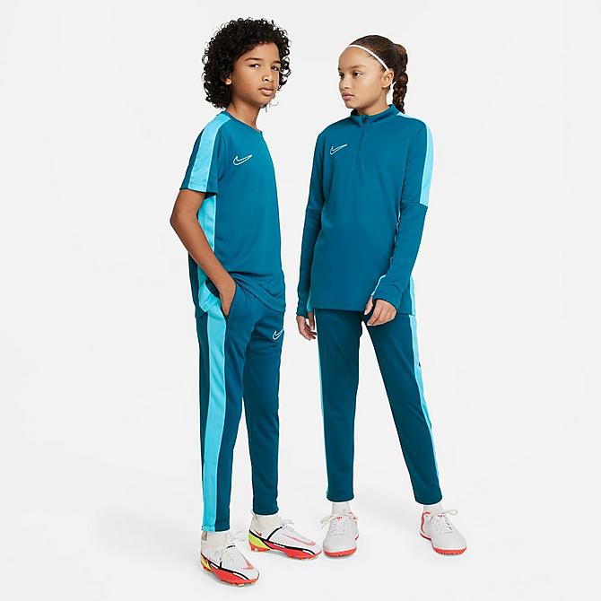 Front Three Quarter view of Kids' Nike Dri-FIT Academy23 Soccer Pants in Green Abyss/Baltic Blue/Green Abyss/White Click to zoom