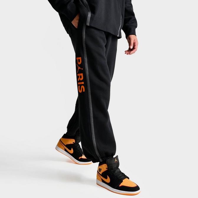 Nike Monogram all over logo print fleece cuffed sweatpants in black