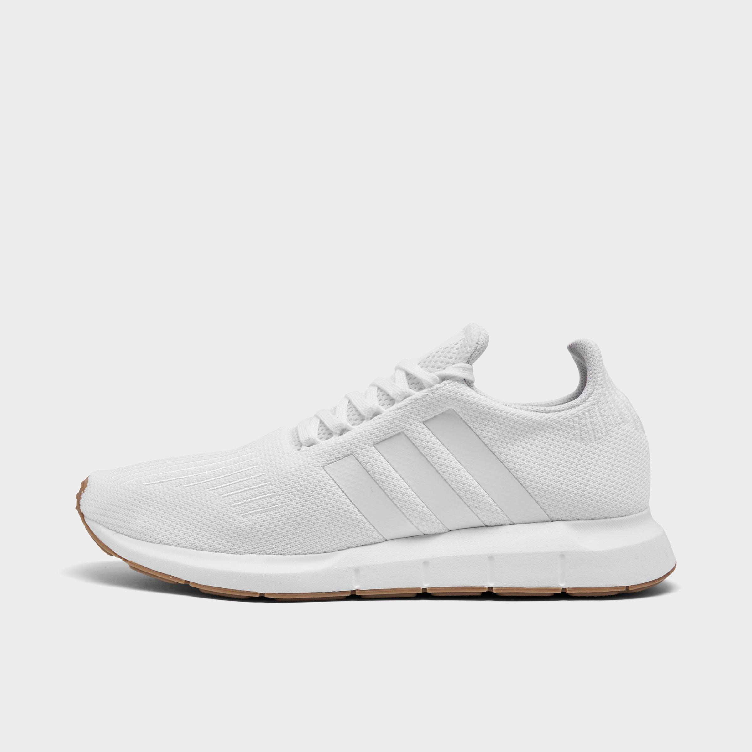 white adidas athletic shoes