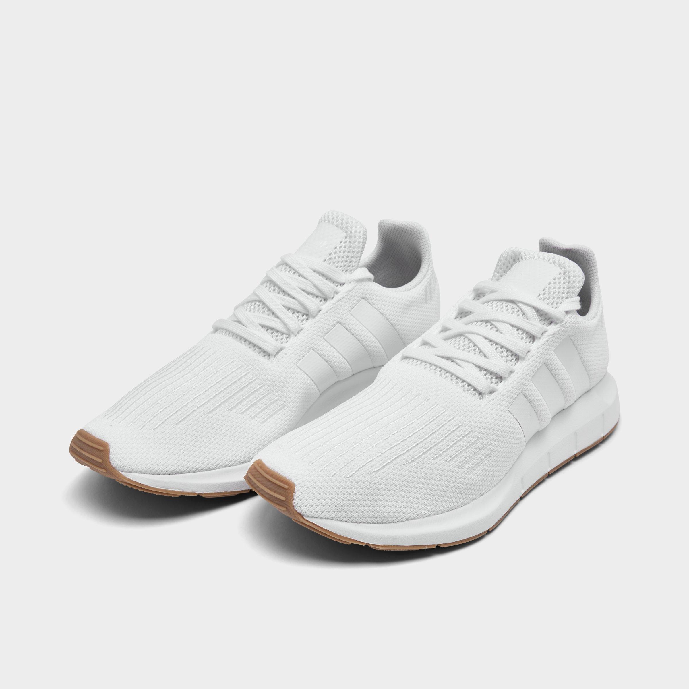 white adidas athletic shoes