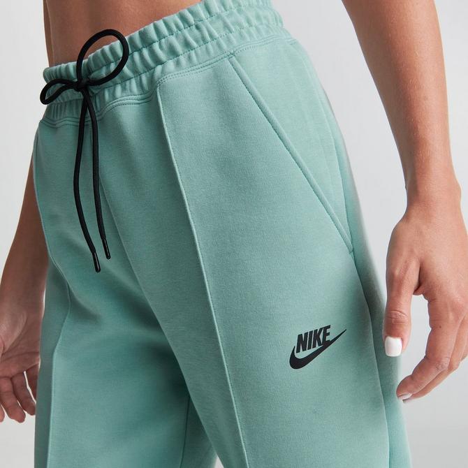 green nike tech pants