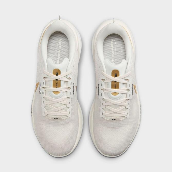 Left view of Women's Nike Vomero 17 Running Shoes in Phantom/Metallic Gold/Light Bone/Sail Click to zoom