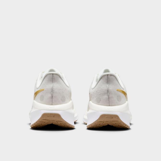 Back view of Women's Nike Vomero 17 Running Shoes in Phantom/Metallic Gold/Light Bone/Sail Click to zoom