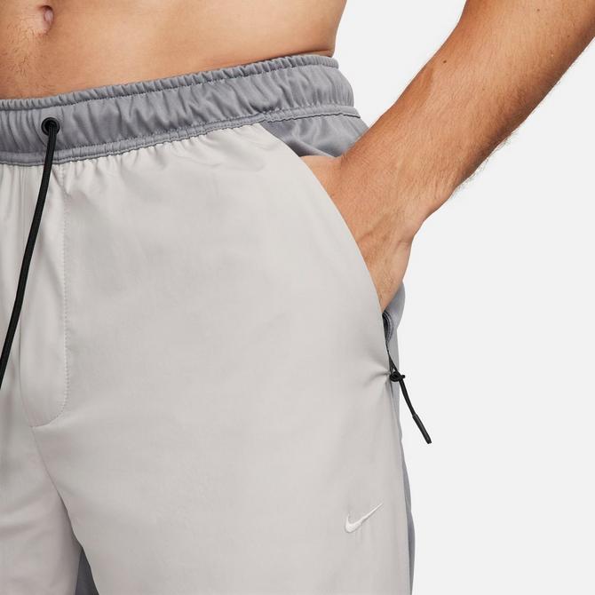 Men's Nike Unlimited Water-Repellent Tapered Versatile Pants| Finish Line