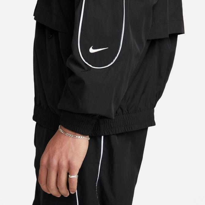 [angle] view of Men's Nike Sportswear Solo Swoosh Woven Track Jacket in Black/White Click to zoom