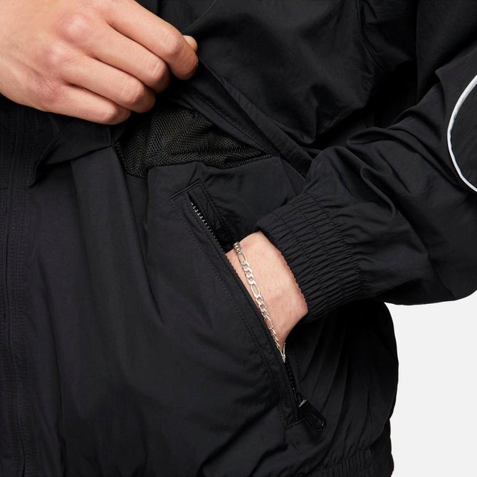 [angle] view of Men's Nike Sportswear Solo Swoosh Woven Track Jacket in Black/White Click to zoom