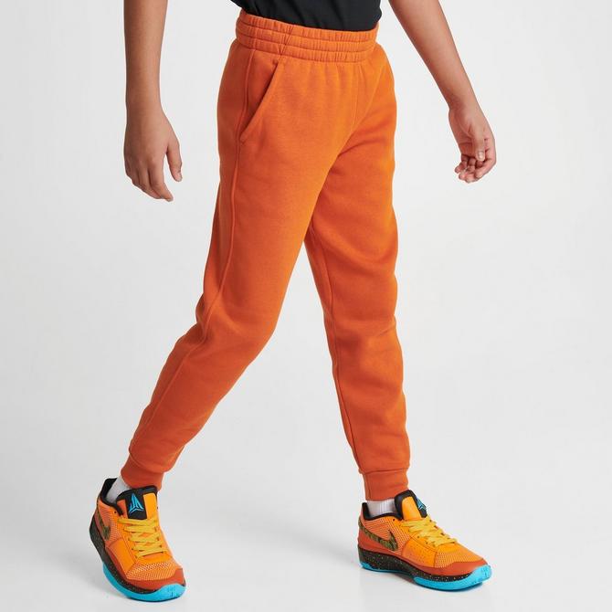 Orange discount nike joggers