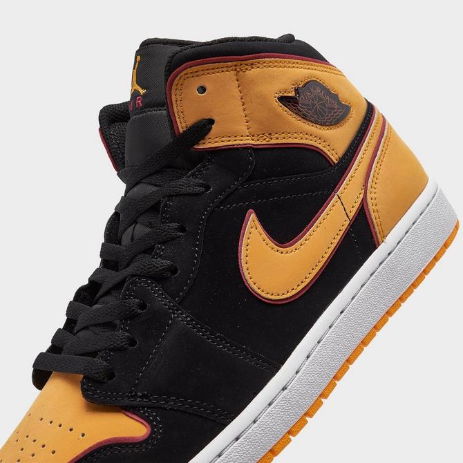 Nike Air Jordan 1 Mid sneakers in orange and black