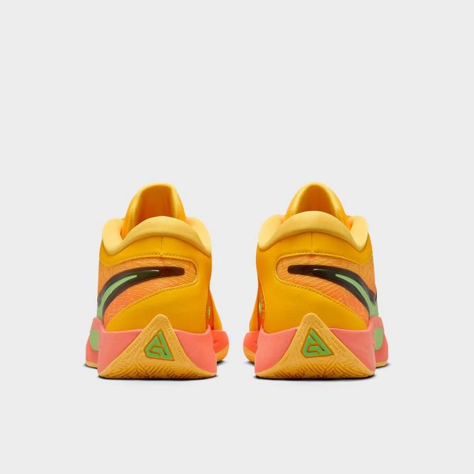 Left view of Nike Giannis Freak 6 Basketball Shoes in Light Wild Mango/Action Green/Black/Laser Orange Click to zoom